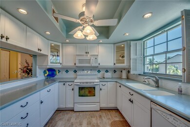 Gorgeous updated Kitchen features custom lighting,
