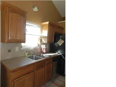 Window over the kitchen sink provides additional n
