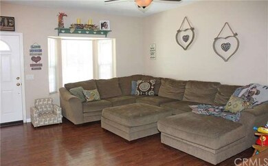 Living Room with Bay Window & Ceiling Fan