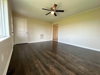 Unfurnished room with dark wood-style floors, ceil
