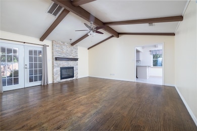 Unfurnished living room with french doors, hardwoo
