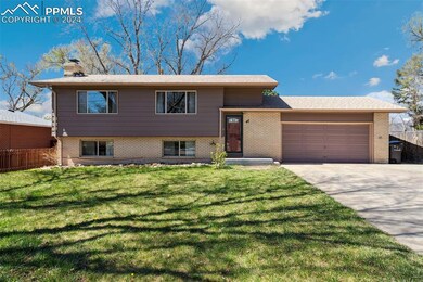 View of front of home featuring a garage and a fro