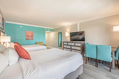 Bedroom featuring ornamental molding and wood finished floors