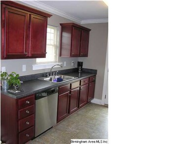 Cherry cabinets with stainless appliances