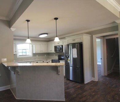 Kitchen has stainless steel appliances.