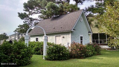 Side Yard and view of detached garage