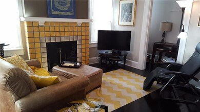 Office alcove adjoining the living area with sleeper loveseat and smart TV