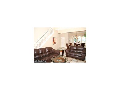 Great room with view of formal dining room and kit