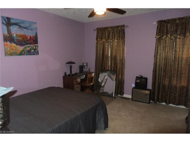 Bedroom #2 ceiling lighted paddle fan, carpeting