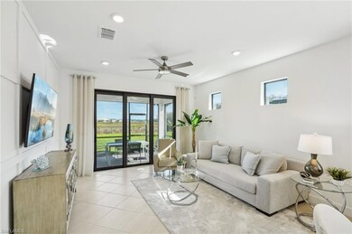 Tiled living room featuring plenty of natural ligh