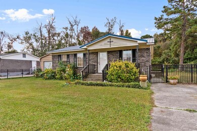 View of front of property with a garage, a front l