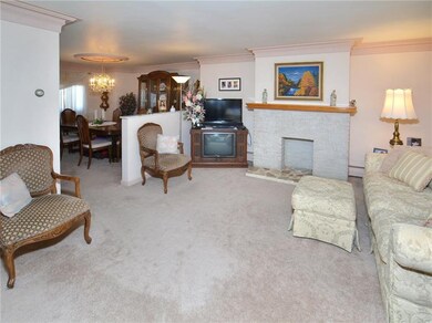 Open floor plan between living and dining rooms. G