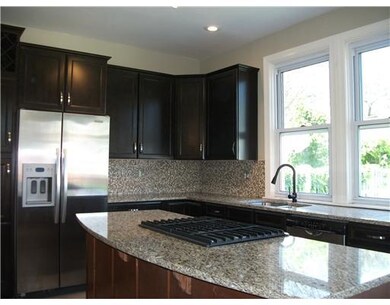 Kitchen. The kitchen has a kitchen aid fridge and 