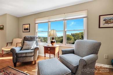 Plentiful windows bathe the room in natural light.