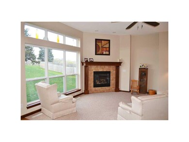 Great Room. Gas fireplace and wall of windows and 