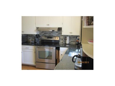 Updated Kitchen  has a pantry, hardwood floor, and