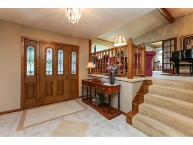 Roomy foyer area leads into the family room and su
