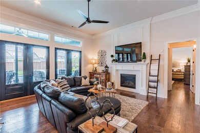 Living room boasts gas log fireplace and easy acce