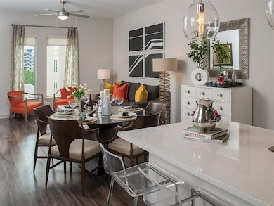 Dining room with dark wood-type flooring and ceili