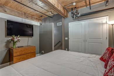  Pictured is a king size bed, double door deep clo