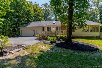 Side yard at the end of driveway.  The side deck e