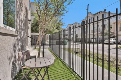 Turfed side yard with gated entry.
