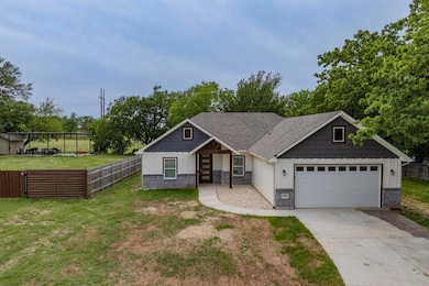 Craftsman-style home featuring fence, a front lawn