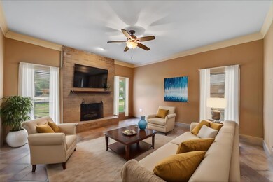 View of front facade with a garage and a front lawn