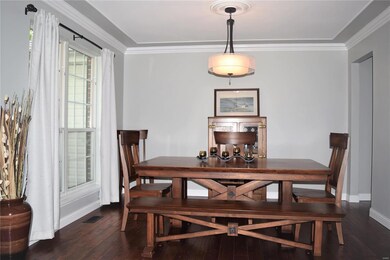 Formal dining room with hardwood floors. Newer lig
