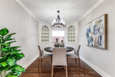 Dining room featuring built-in china cabinets, a n