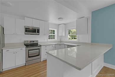 Kitchen with appliances with stainless steel finis