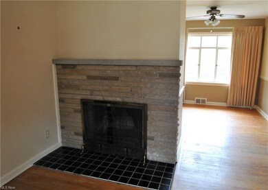 Natural stone fireplace surround and ceramic tile 