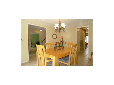 Tile in entry, through dining room, and into kitch