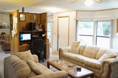 Living room has computer niche