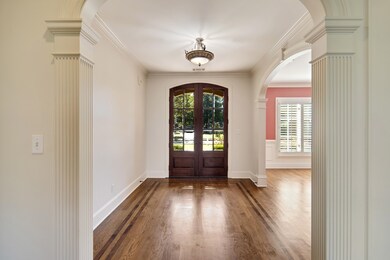 Foyer entrance featuring ornamental molding, frenc