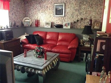 Lower level bonus/family room with wall shelf, lar