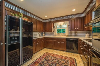The custom-designed kitchen features solid cherry 