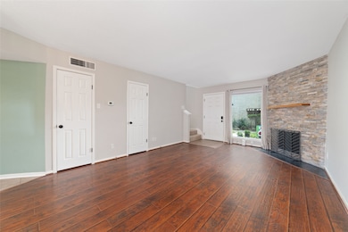 This spacious living room is filled with natural l