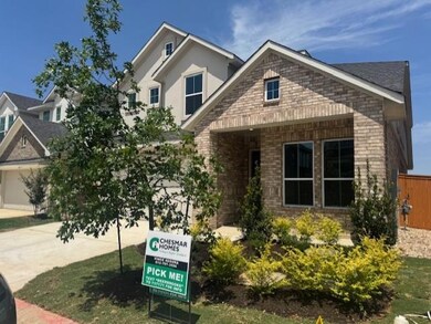 View of front of home featuring brick siding, con
