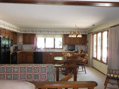 kitchen open stairway to lower level