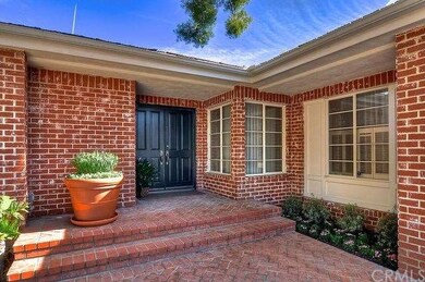Charming brick entry with double doors