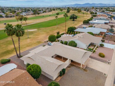 AERIAL OF HOME OVERLOOKING GOLF COURSE