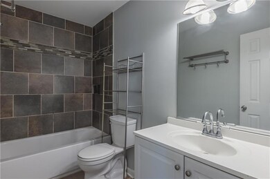 Full bath featuring shower / washtub combination and vanity