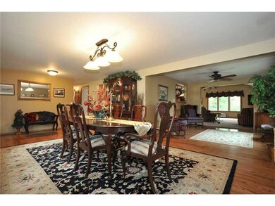 Dining Room. The dining room opens to a sitting ar