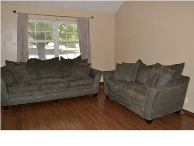 Formal Living room with ceiling fan, vaulted ceili