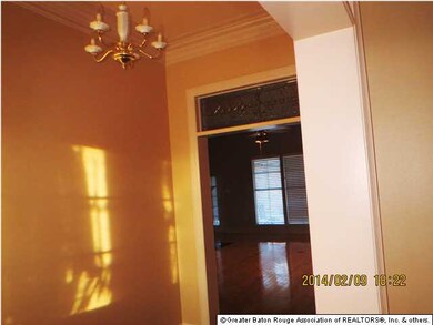 Notice leaded glass transom in foyer