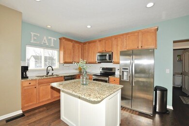 Bright sunny windows and stainless appliances