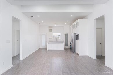 Unfurnished living room with recessed lighting, visible vents, baseboards, and light wood finished floors