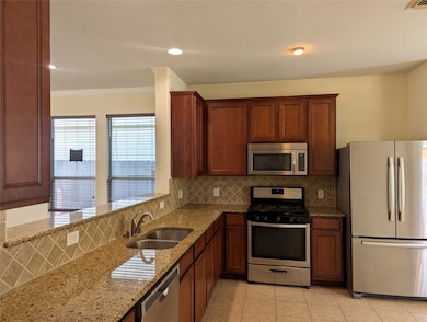 High grade granite counter tops and breakfast bar, stainless steel appliances