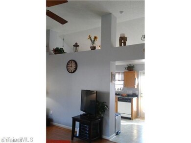Living Room. Opening in Living Room and Kitchen Gives a Spacious Feel